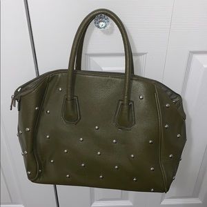 green studded bag with shoulder strap
